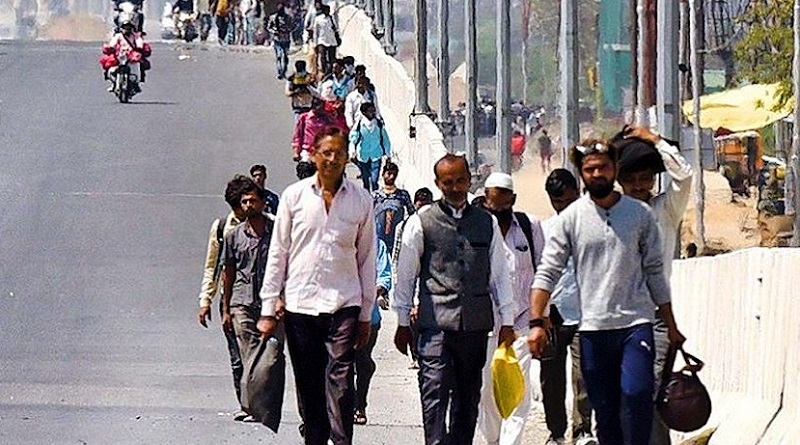 stranded workers walk through roads