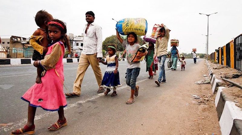 stranded workers walk through roads