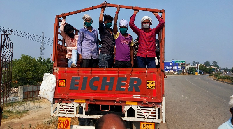 workers rides on truck in up