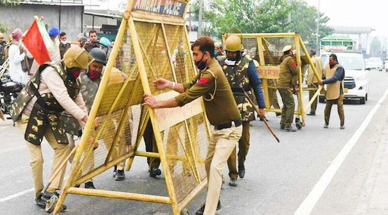 Farmers protest police barricade