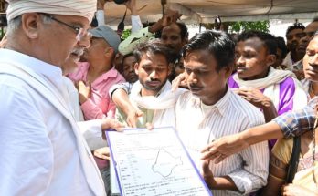 CM Baghel with villagers in Gudiyapadar of Kanger valley handing down the CFR certificate