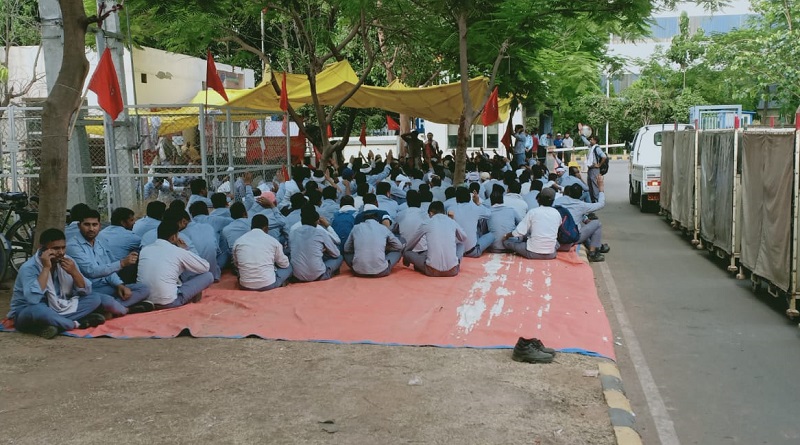 https://www.workersunity.com/wp-content/uploads/2023/05/Bellsonica-workers-at-factory-gate-manesar.jpg