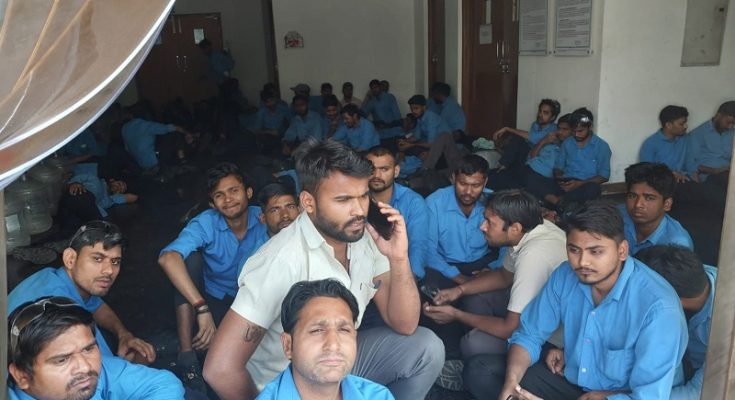 https://www.workersunity.com/wp-content/uploads/2023/05/Proterial-workers-sit-in-inside-factory.jpg