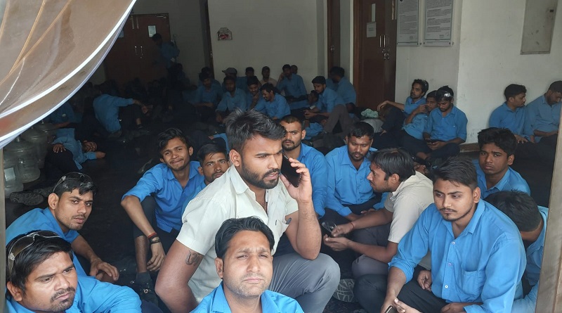 https://www.workersunity.com/wp-content/uploads/2023/05/Proterial-workers-sit-in-inside-factory.jpg