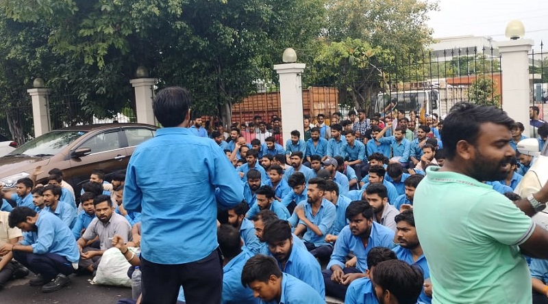 https://www.workersunity.com/wp-content/uploads/2023/07/Proterial-hitachi-worker-inside-factory-gate-imt-manesar.jpg